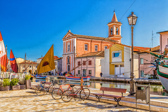 Church, boats and bycicles on Canal Port
