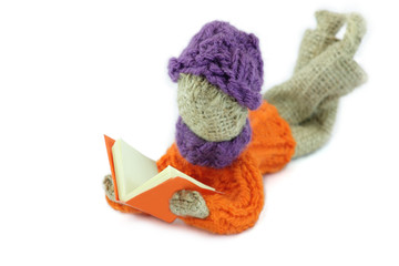 Boy reading a red book crafts burlap