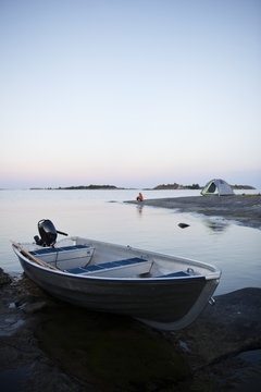 Boat on coast at dusk