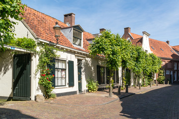 Fototapeta na wymiar Street scene of Muurhuizen, wall houses, in old town of Amersfoort in Utrecht province, Netherlands