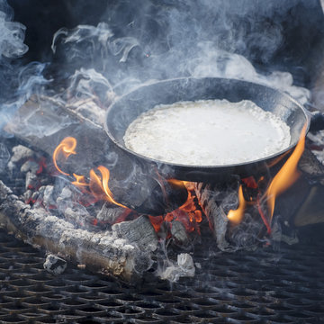 Pan with food on fire