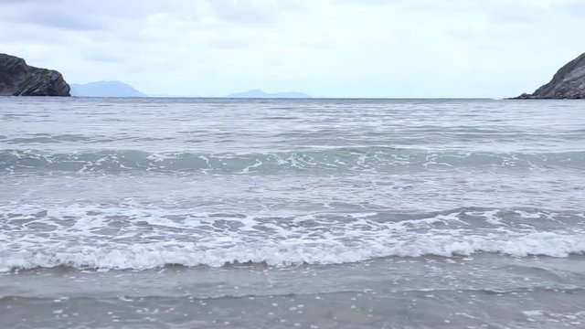 The Beach of Gorliz, Basque Country, Spain, with normal tide levels on a cloudy day.