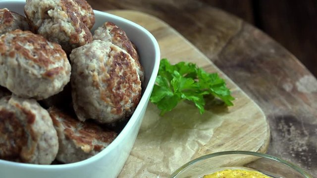 Portion of Mini Burgers as not seamless loopable 4K UHD footage