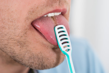 Man Cleaning Her Tongue