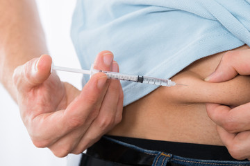 Diabetic Man Injecting Stomach
