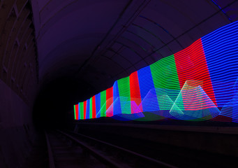 Primary colored LED lights lighting up a dark tunnel