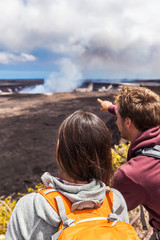 Hawaii scene. Hiking people looking at Hawaiian volcano: Halemaumau crater within the Kilauea...