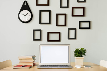 workspace decorate with frame and plant