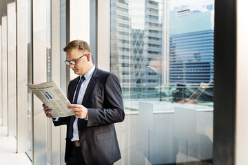 Fototapeta premium Business Man Working Reading Newspaper Concept