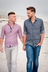 Gay couple walking holding hands