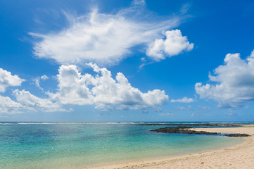 Fototapeta na wymiar Landscape with clouds on the shore of the ocean. Mauritius Island