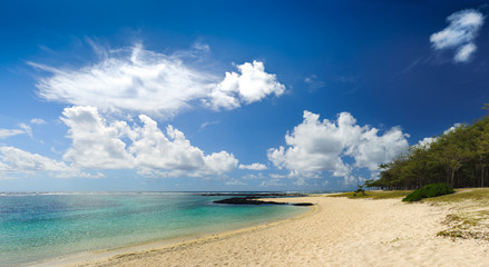 Panorama with clouds on the shore of the ocean. Mauritius Island