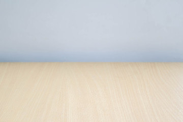 Empty perspective wood over color blur background