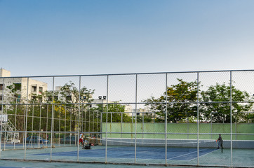 Fototapeta premium Tennis cort in park,excercise and relax,morning light