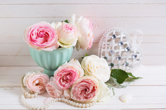 Background with  pink roses flowers  and decorative heart