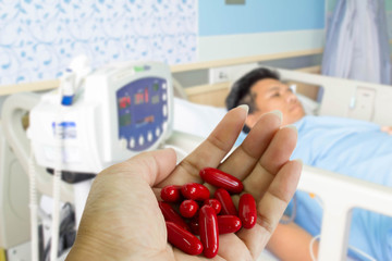 vitamin pills in hand