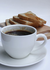Coffee and peanut Butter bread on cutting board on the white bac