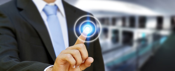 Businessman touching modern tactile screen button