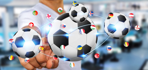 Businessman holding football in his hand