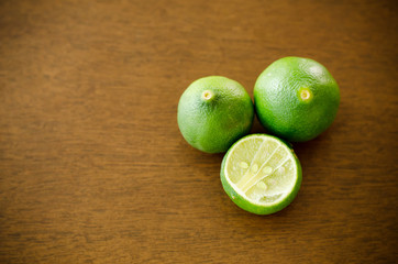 Fresh lime on wooden background