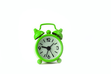 Green clock on white background.