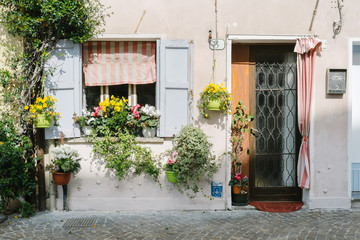 Fototapeta na wymiar Flowered window. Caorle, Venice - Italy