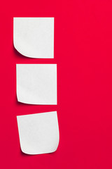 Reminder sticky notes on red background