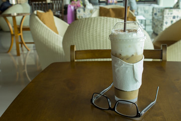 iced coffee on wood table in coffee cafe