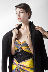Woman wearing a chivalrous gentlemans coat demonstrates politeness