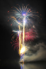 Colorful fireworks over night the water