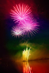 Colorful fireworks above water
