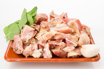 pig's ear cut into with condiments isolated on white