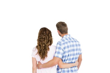 Rear view of young couple embracing