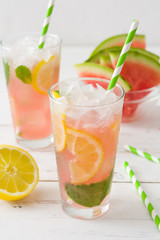 Fresh watermelon mojito on white wooden table
