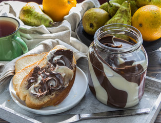 Paste made of white and milk chocolate on bread for Breakfast