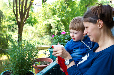 mother and son gardening plant