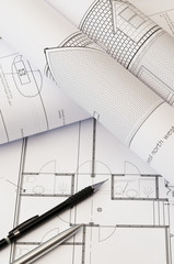 Architectural drawings and plans.
Close up image of architects drawings and plans with a pen and pencil laid on the drawings,
