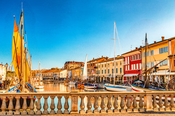 ancient sailboats on Italian Canal Port