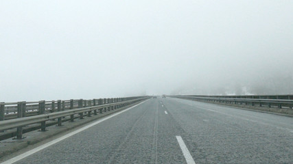 Highway with fog and reduced visibility.