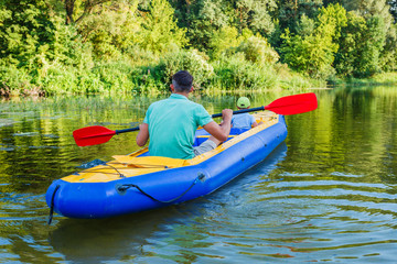 Family kayaking on the river