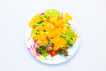 Delicious salad on a bowl isolated over white