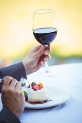 Businesswoman having a desert with wine