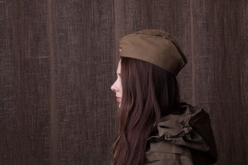 Woman in Russian military uniform. Female soldier during the second world war.