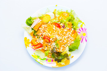 Delicious salad on a bowl isolated over white