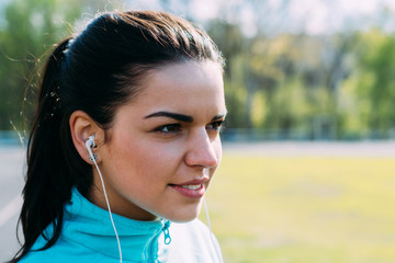 beautiful girl listening to music before a workout