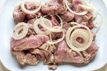 Fresh raw pork fillet steak  meat with sliced onion