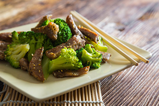 Asian cuisine, grilled meat with broccoli and sesame