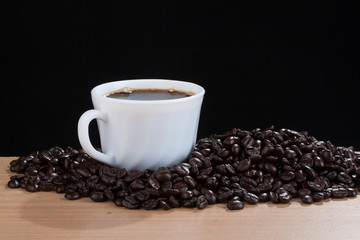 coffeebeans around white cup on wooden #1