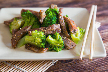 Asian cuisine, grilled meat with broccoli and sesame