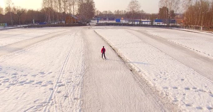 A man skiing at empty stadium
